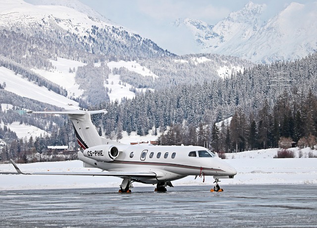 private jet wing above clouds with soft gold light